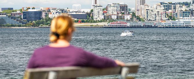 Woman sitting watching the Space Needle in Seattle