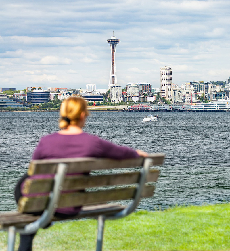 Woman sitting watching the Space Needle in Seattle